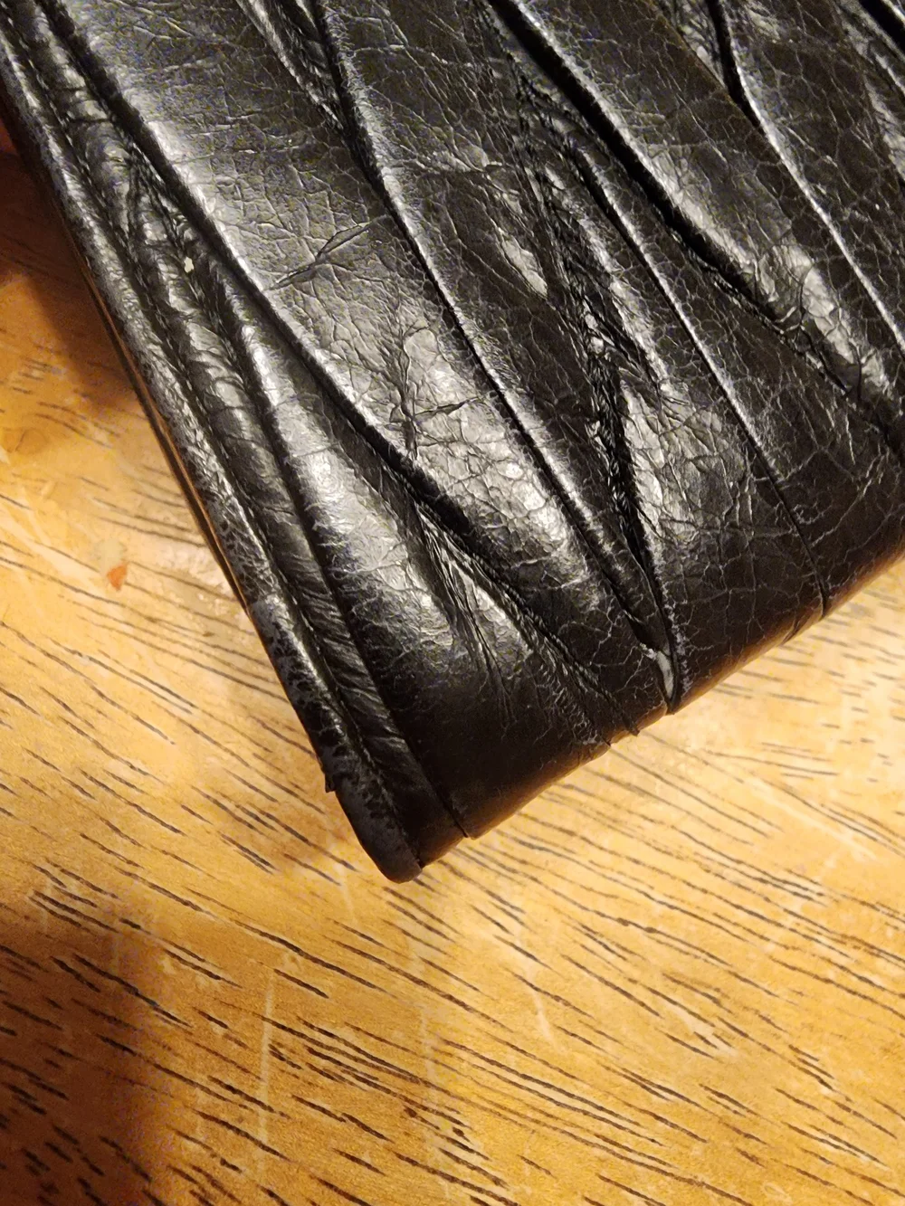 black quilted leather Miu Miu Matelassé long bifold wallet gold-tone Logo